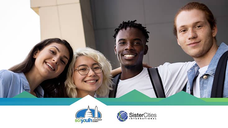 A group of Youth posing for a photo in front of a building at the SCI Youth Leadership Summit.