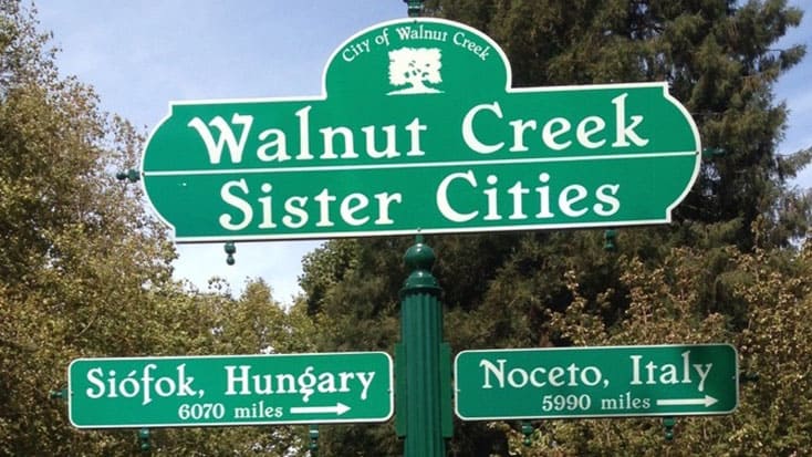 A walnut creek sister cities directional street sign