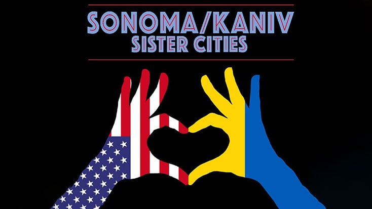 Sonoma-Kaniv sister cities committee graphic showing two hands making a heart shape with overlay of the U.S. and Ukraine flags